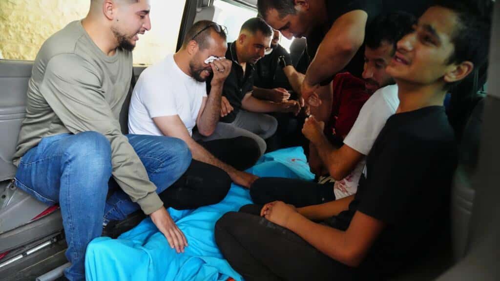 Israeli settlers and military kill 2 Palestinians – one a teenager – in separate West Bank shootings